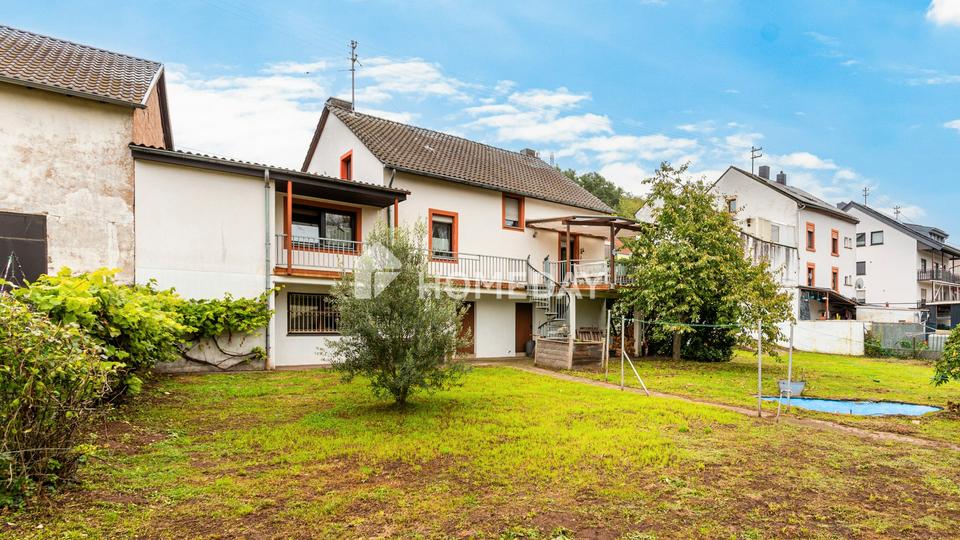 Hier wohnt, wer das Echte schätzt: charmantes EFH mit Einliegerwohnung, großem Garten und Garage – Bild 3