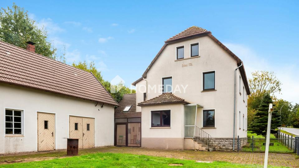Charmantes Zweifamilienhaus mit großem Grundstück in ruhiger Lage – Bild 2