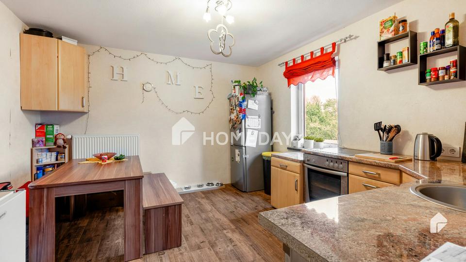 Charmantes Mehrfamilienhaus mit zwei Wohneinheiten, Garage, Carport und großzügigem Garten – Bild 4