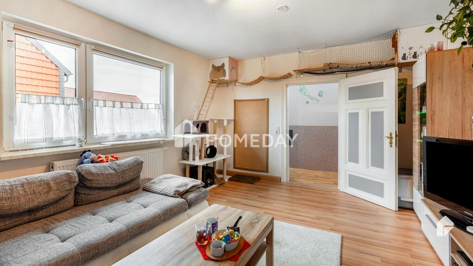 Charmantes Mehrfamilienhaus mit zwei Wohneinheiten, Garage, Carport und großzügigem Garten – Bild 2