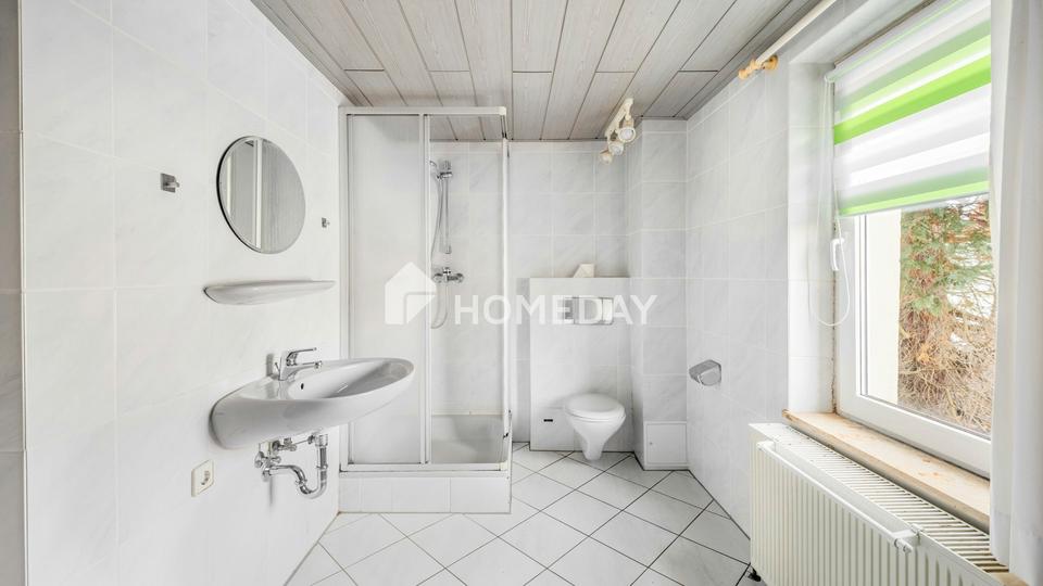 Familienfreundliches Einfamilienhaus mit 6 Zimmern, Garten, Balkon und Garagen – Bild 16