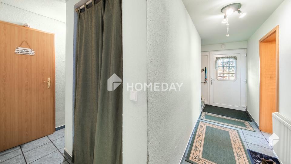 Am Feldrand und idyllisch gelegen: DHH mit Südterrasse, EBK + Carport | Gepflegt | Großes Grundstück – Bild 4