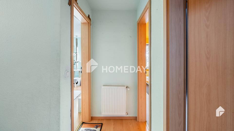 Am Feldrand und idyllisch gelegen: DHH mit Südterrasse, EBK + Carport | Gepflegt | Großes Grundstück – Bild 7