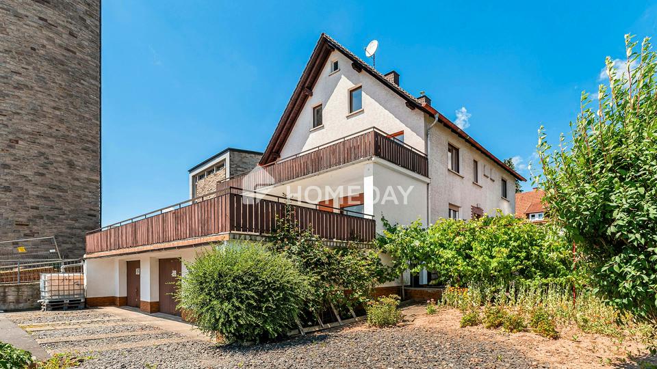 Charmantes MFH mit drei Wohneinheiten, 3 Garagen und Stellplätzen in attraktiver Lage von Neuhof – Bild 3