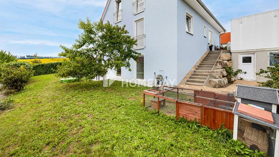 Modernes Einfamilienhaus mit Einliegerwohnung in Hanglage und tollem Ausblick – Bild 7