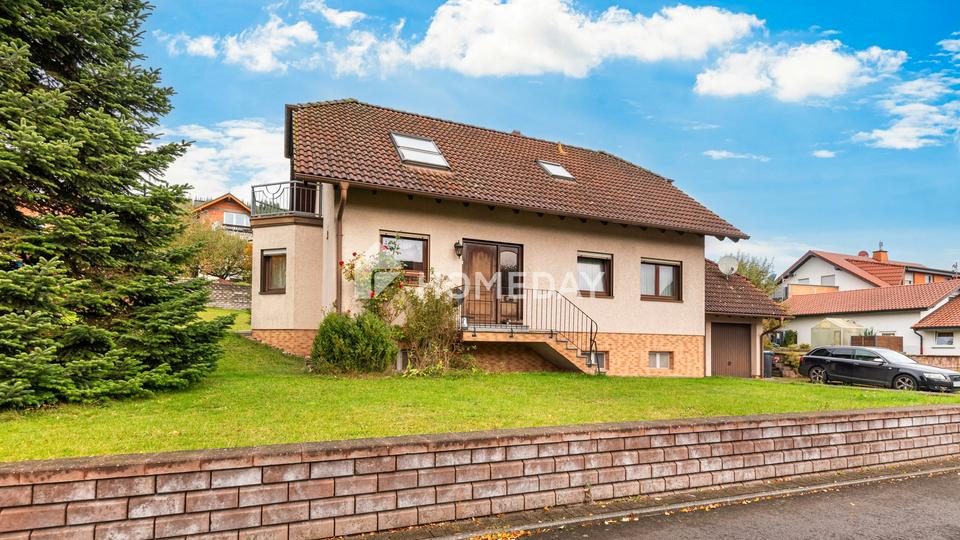 Familienfreundliches EFH mit großem Garten, Terrasse, EBK und Garagen in ruhiger Lage – Bild 3