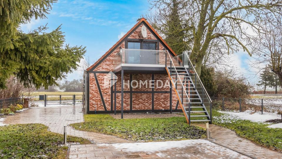 Wohnen auf zwei Ebenen – Einfamilienhaus mit Balkon, Terrasse und Garten – Bild 2
