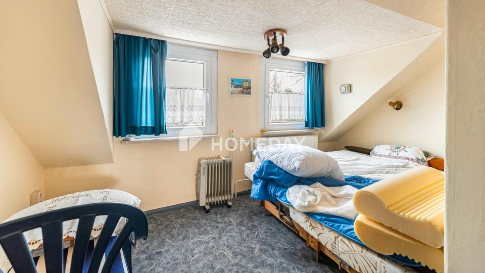 Stilvolles Zweifamilienhaus mit Vollkeller, Gartenidylle und vielseitigen Nutzungsmöglichkeiten – Bild 33