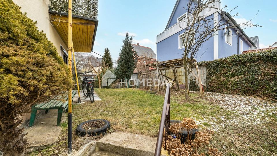 Großzügig & vielseitig: Zweifamilienhaus mit Garten, 2 Garagen und Balkonen in Krondorf – Bild 4